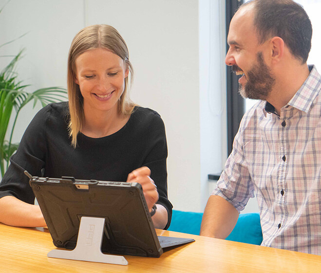 hero - Two Microsoft Office 365 consultants on a laptop at a course in New Zealand