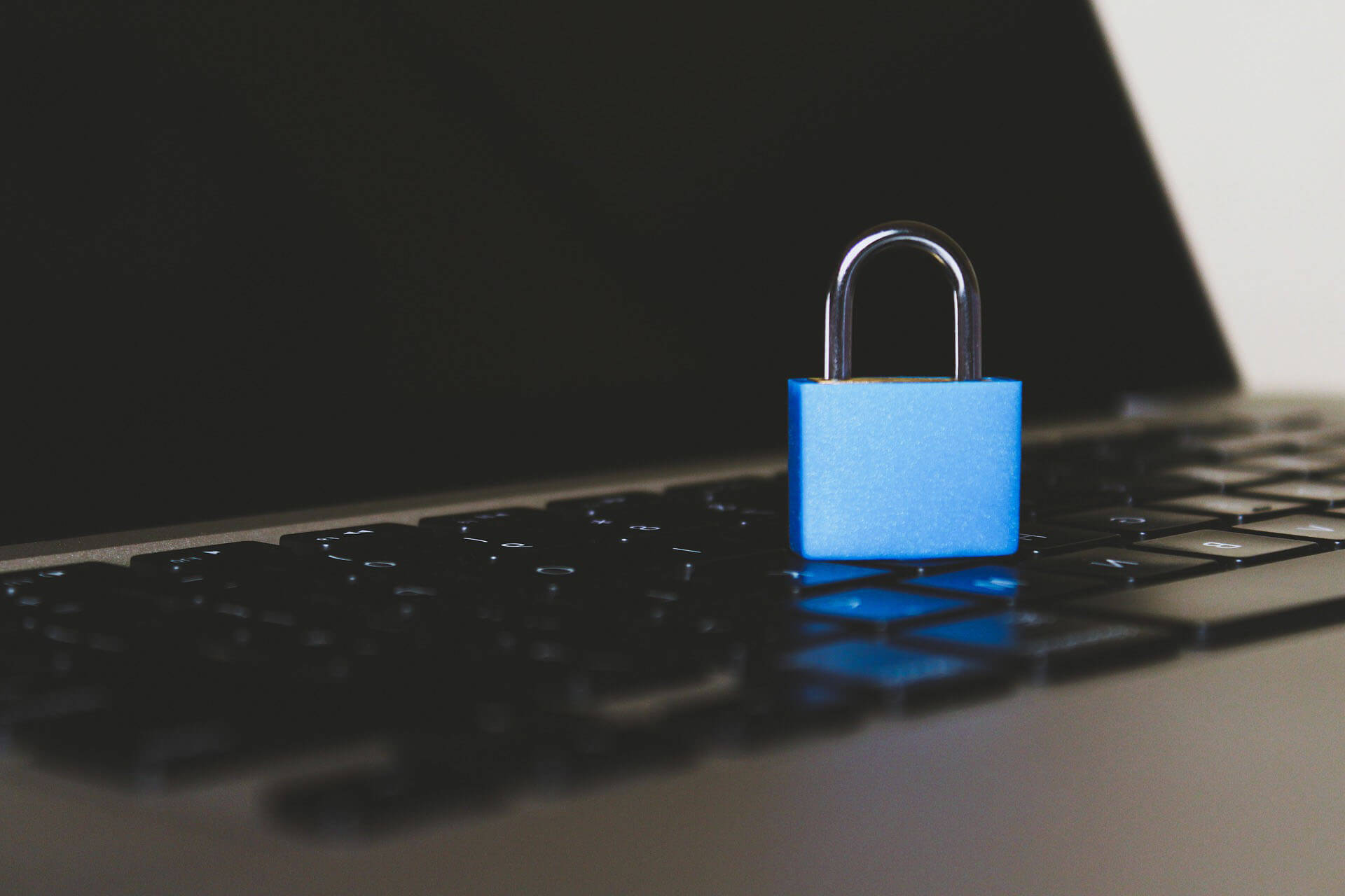 news - A security lock sitting on a laptop keyboard